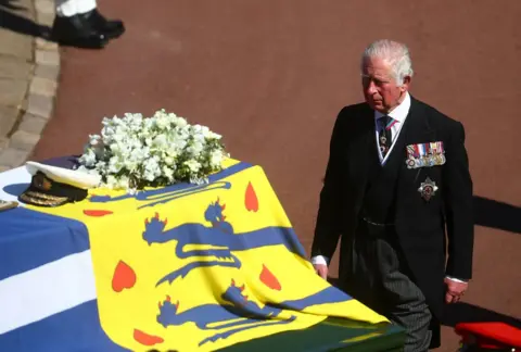 PA Media The Prince of Wales walks behind The Duke of Edinburgh's coffin, covered with His Royal Highness's Personal Standard, outside St George's Chapel, Windsor Castle, Berkshire, before the funeral of the Duke of Edinburgh. April 17, 2021.