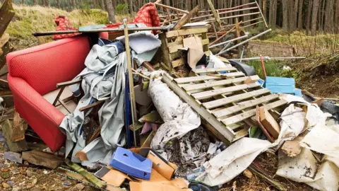 Getty Images A pile of rubbish in a forest