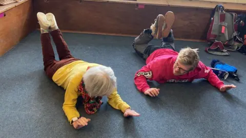 Matthew Moor Shirley and instructor seen practising skydive moves