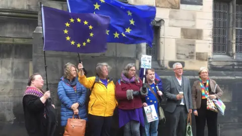 PA Media Protesters outside the court on Wednesday