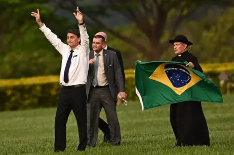 EPA Bolsonaro meets with supporters in front of the Alvorada Palace in Brasilia, Brazil - 12 Dec 2022