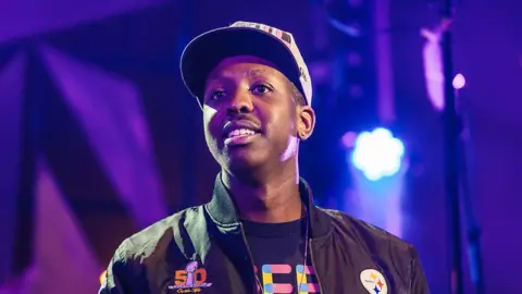 Getty Images Jamal Edwards presents an award at NCS YES Live at The Roundhouse on March 29, 2016 in London, England