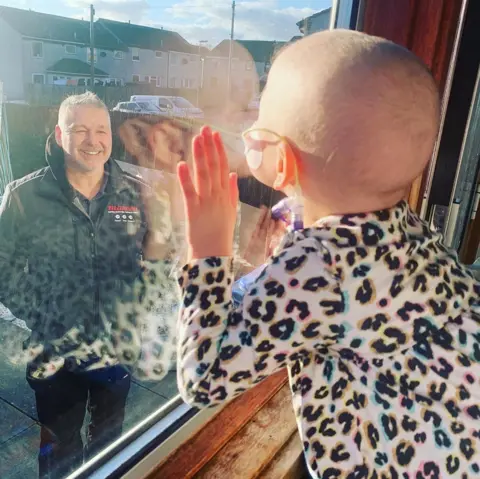 Lynda Sneddon Mila, looking out of the window