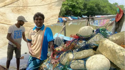 Fishermen with their boat