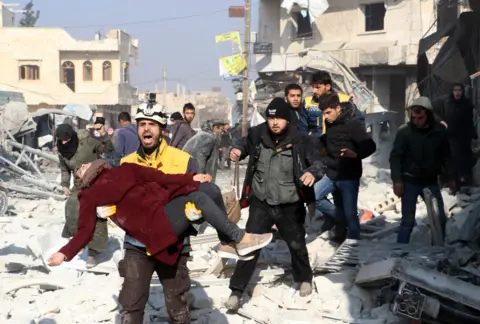 Getty Images Laith al-Abdullah calling for an ambulance to take an injured student to hospital