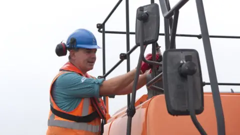 BBC Doug filling excavator