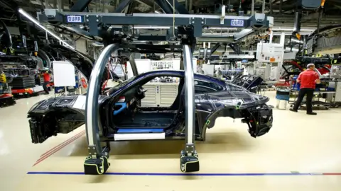 Reuters A Porsche 911 being built in a Porsche factory