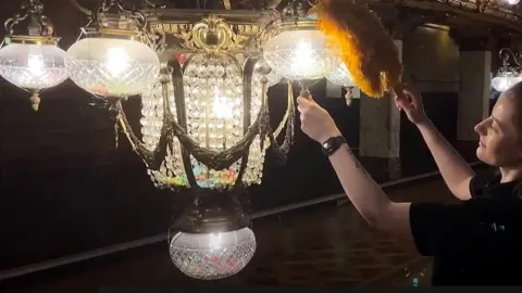 Cleaning the chandeliers at Blackpool Tower