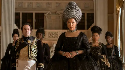 Netflix Hugh Sachs and Golda Rosheuvel in Queen Charlotte: A Bridgerton Story