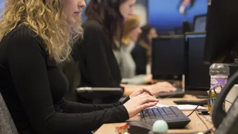 PA Media Workers at desks