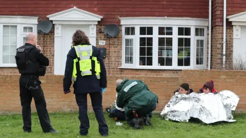 Gareth Fuller/PA Paramedic inspects migrnats