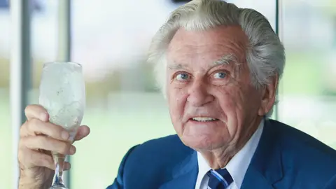 Getty Images Bob Hawke holds a glass of beer