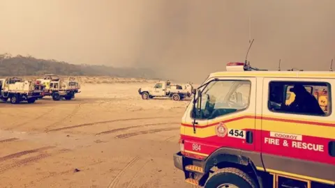 QFES Fire trucks on the beaches at Fraser Island during the major bushfires in December 2020