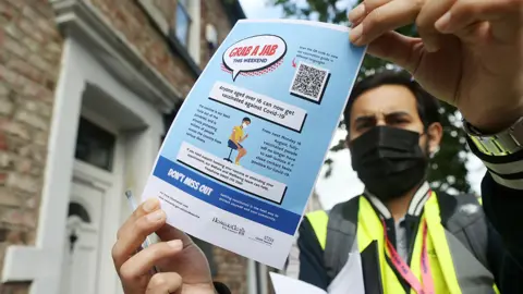 BBC Member of the Covid vaccine rapid response team in Newcastle's West End on Friday encouraging people to get a jab