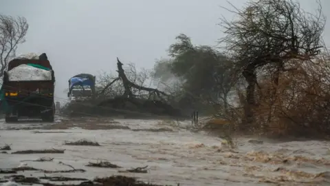 Getty Images A flooded highway near Diu after the storm blasted ashore