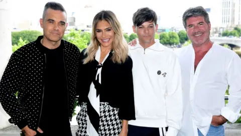 PA Robbie Williams, Ayda Field, Louis Tomlinson and Simon Cowell