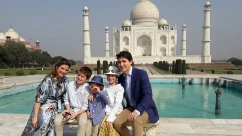 EPA Canadian Prime Minister Justin Trudeau (R), accompanied by his wife Sophie Gregoire Trudeau (L) and their children pose for photographs at the landmark Taj Mahal in Agra, India, 18 February 2018.