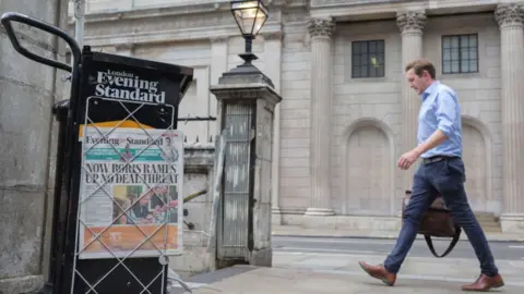In Pictures / Getty Images A man walks past the Bank of England while an Evening Standard headline warns of a threat of no-deal Brexit