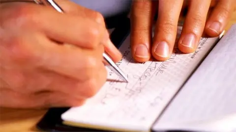 cheque being written