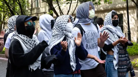 Pro-Palestinian protestors near an entrance to Columbia University on 30 April 2024