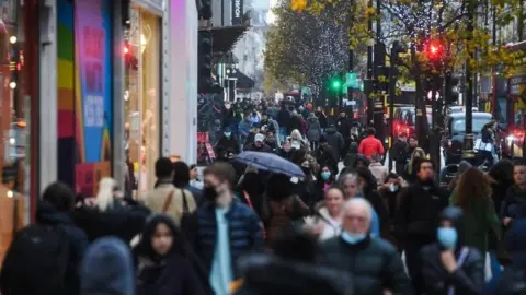 PA Media Shoppers on Oxford Street in London