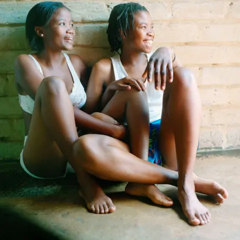 Zanele Muholi Two people sitting on the floor