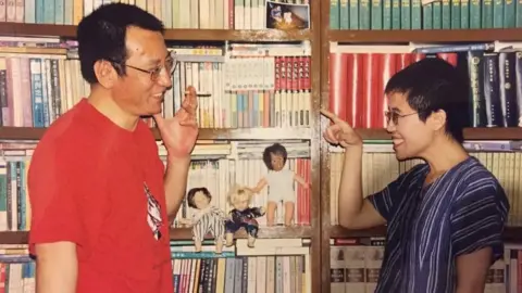 Supplied Liu Xiaobo and Liu Xia grinning at each other