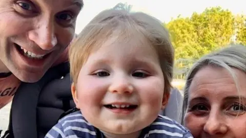 Amy Moffatt Oakley with his parents