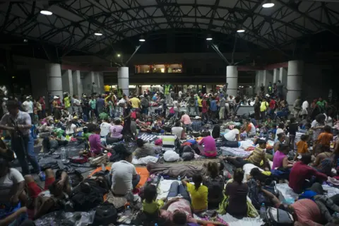 Encarni Pindado Migrants rest in the main square in Tapachula