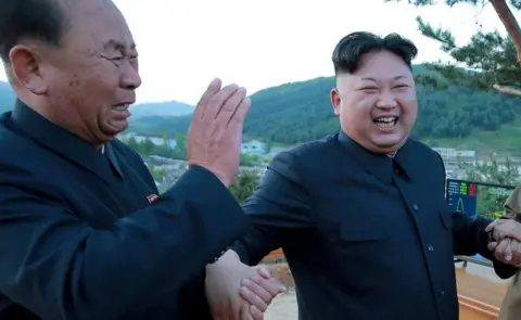 KCNA/Reuters North Korean leader Kim Jong Un (R) reacts with Ri Pyong Chol (L) in this undated photo
