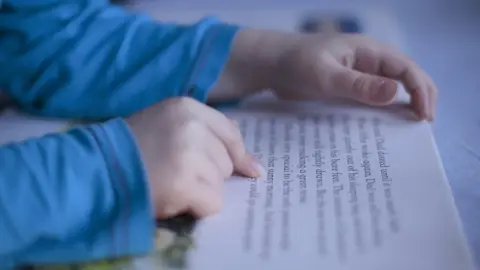 Getty Images Child reading