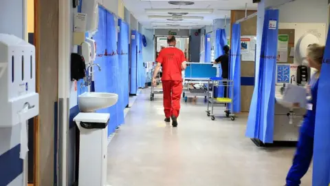 PA Media Staff in hospital ward