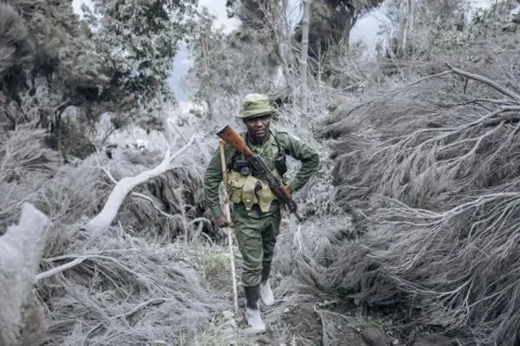 AFP A park ranger walks up Mount Nyiragongo.