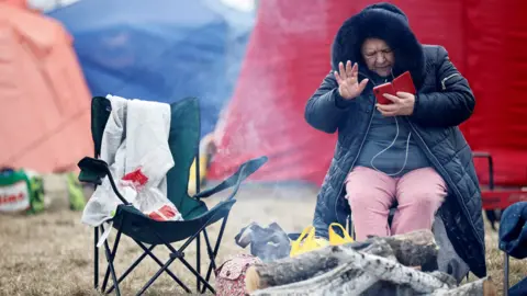 Reuters A refugee at Polish camp