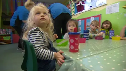 BBC Children sat at a table