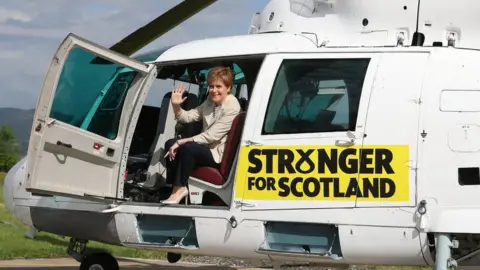 Andrew Milligan Nicola Sturgeon in helicopter.