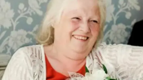 Esther Martin sitting down and smiling