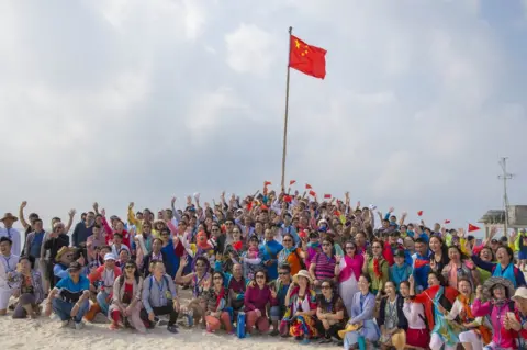 China News Service Picture of a Chinese tour group on one of the Paracel Islands on 4 March 2017