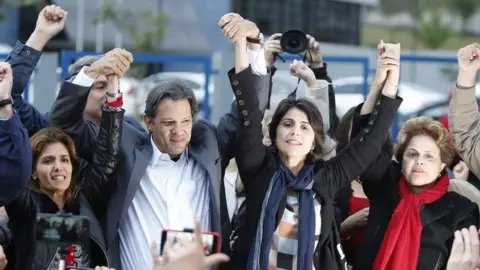 EPA Ana Estela Haddad, Fernando Haddad, Manuela D'Avila and former President Dilma Rousseff participate in the announcement of Fernando Haddad as the Workers' Party's new candidate