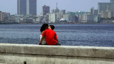 Getty Images A couple kisses at Havana's seafront on August 3rd, 2006.
