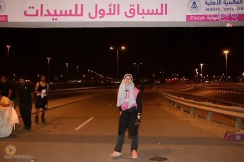 Instagram/@jeddah_women Race organiser Nadima Abu Al-Enein posing for a photo in the finishing line