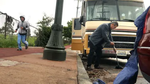 Getty Images People tidy up outside their motorhome