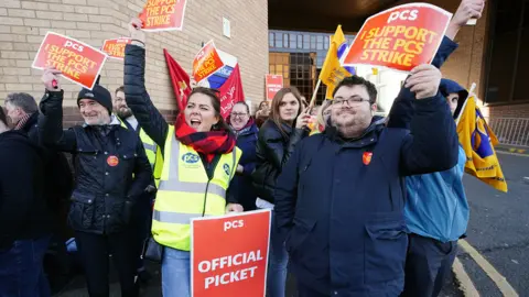 PA Media PCS members on the picket line outside the Glasgow Passport Office on 3 April