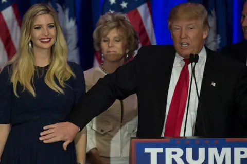 Getty Images Trump pats his pregnant daughter Ivanka during his campaign