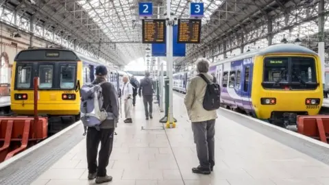 Transport for Greater Manchester Rail passengers at Manchester Piccadilly station