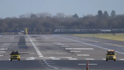 PA Gatwick Airport was closed after drones were spotted over the airfield