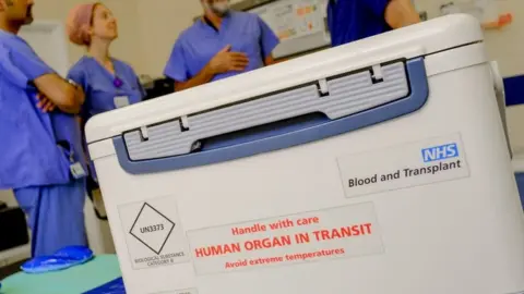 NHS Blood and Transplant Box with organ for transplant reading "handle with care: human organ in transit"