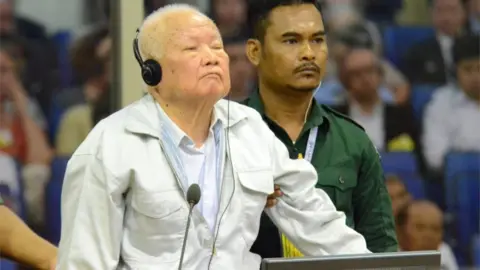 Reuters Khieu Samphan stands in court