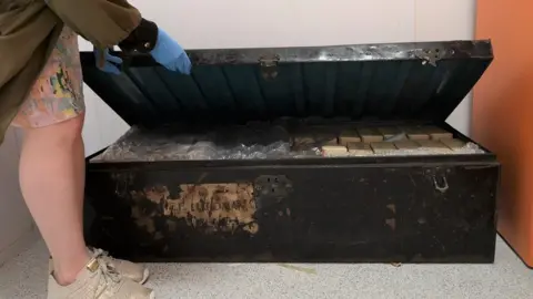 National Trust Opening a large chest used by E. Chambre Hardman to store his work