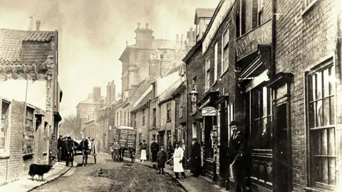 Jack Rose Collection Lowestoft High Street looking north, 1897. The only building in this view still standing is Arnold House which can be seen in the far distance.